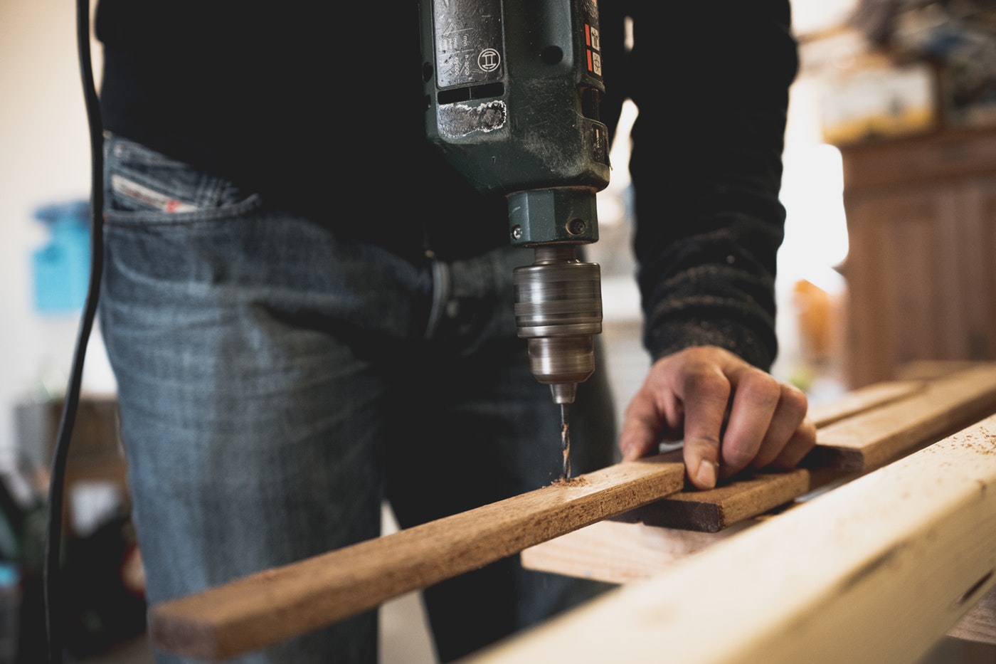 a contractor using a drill